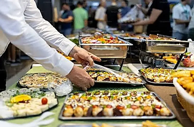 Evergreen Catering Chef serving canapés at a buffet for Aylesbury
