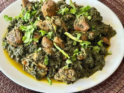 Bowl of palak gosht curry