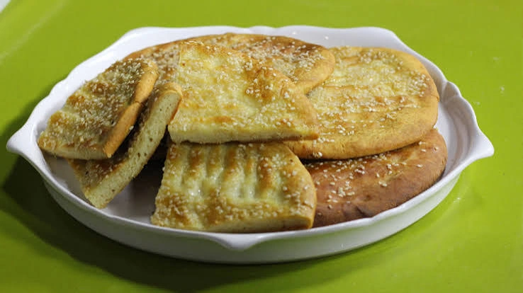 Roghni naan bread with sesame topping