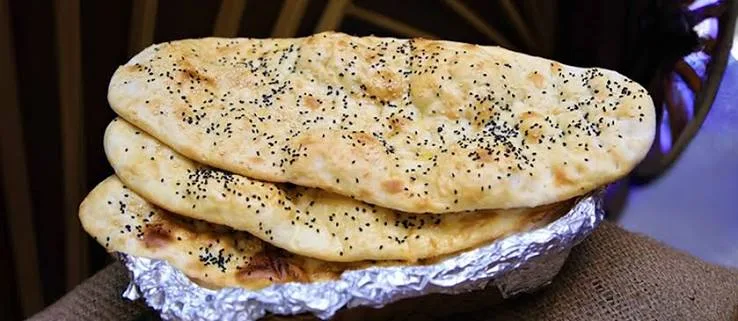 Afghani naan bread fresh from the tandoor