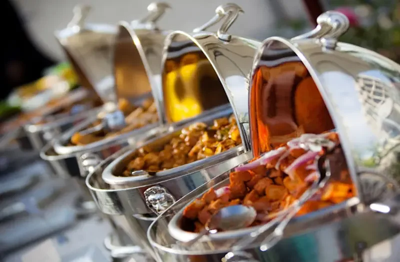Evergreen Catering Silver chafing dishes with catering food for Northampton