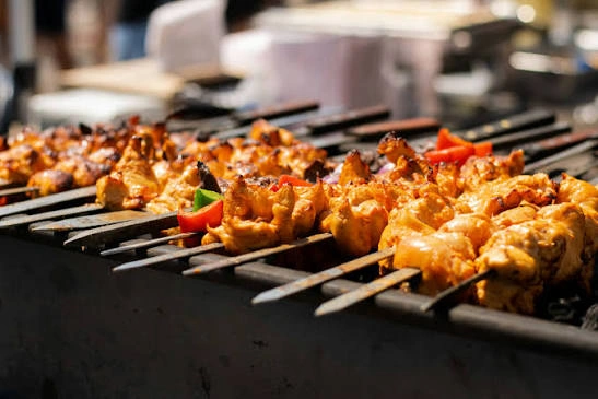 Skewered chicken boti pieces