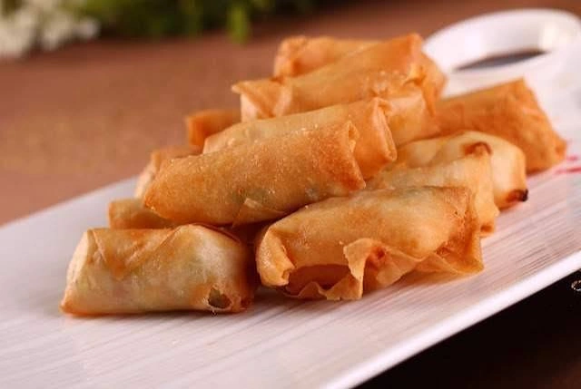 Fried chicken spring rolls sliced in half